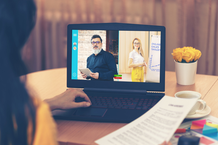 Business woman talking to colleagues about online sales in video conference - Multi ethnic business team using laptop for online meeting in video call - Group of people virtual smart working from home