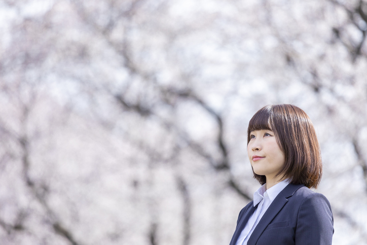 Woman in suit and cherry blossom