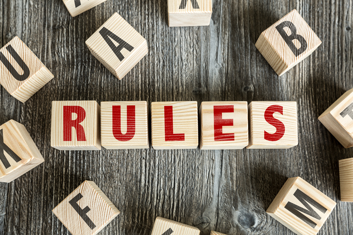 Wooden Blocks with the text: Rules